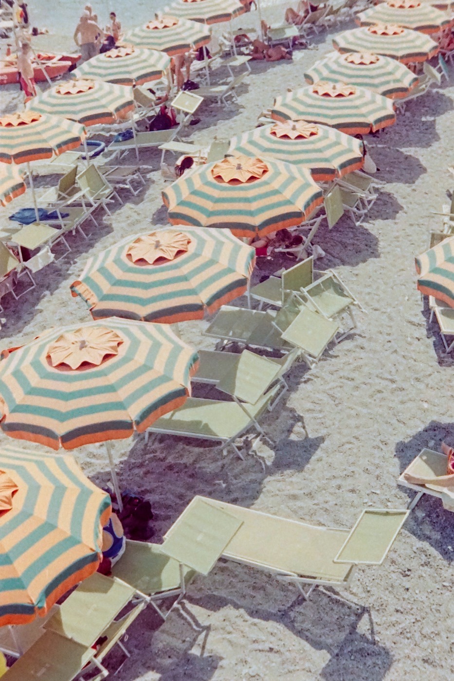 Striped beach umbrellas from above
